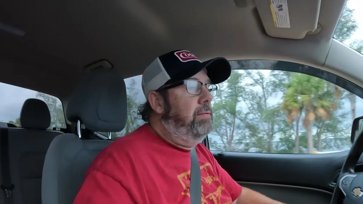 Derek driving while reflecting on what experience has taught him