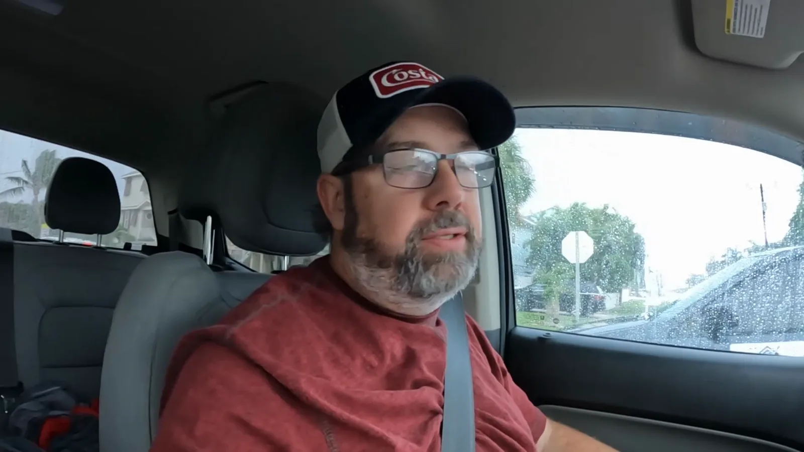Derek sitting in his truck while island traffic remains backed up in the rain