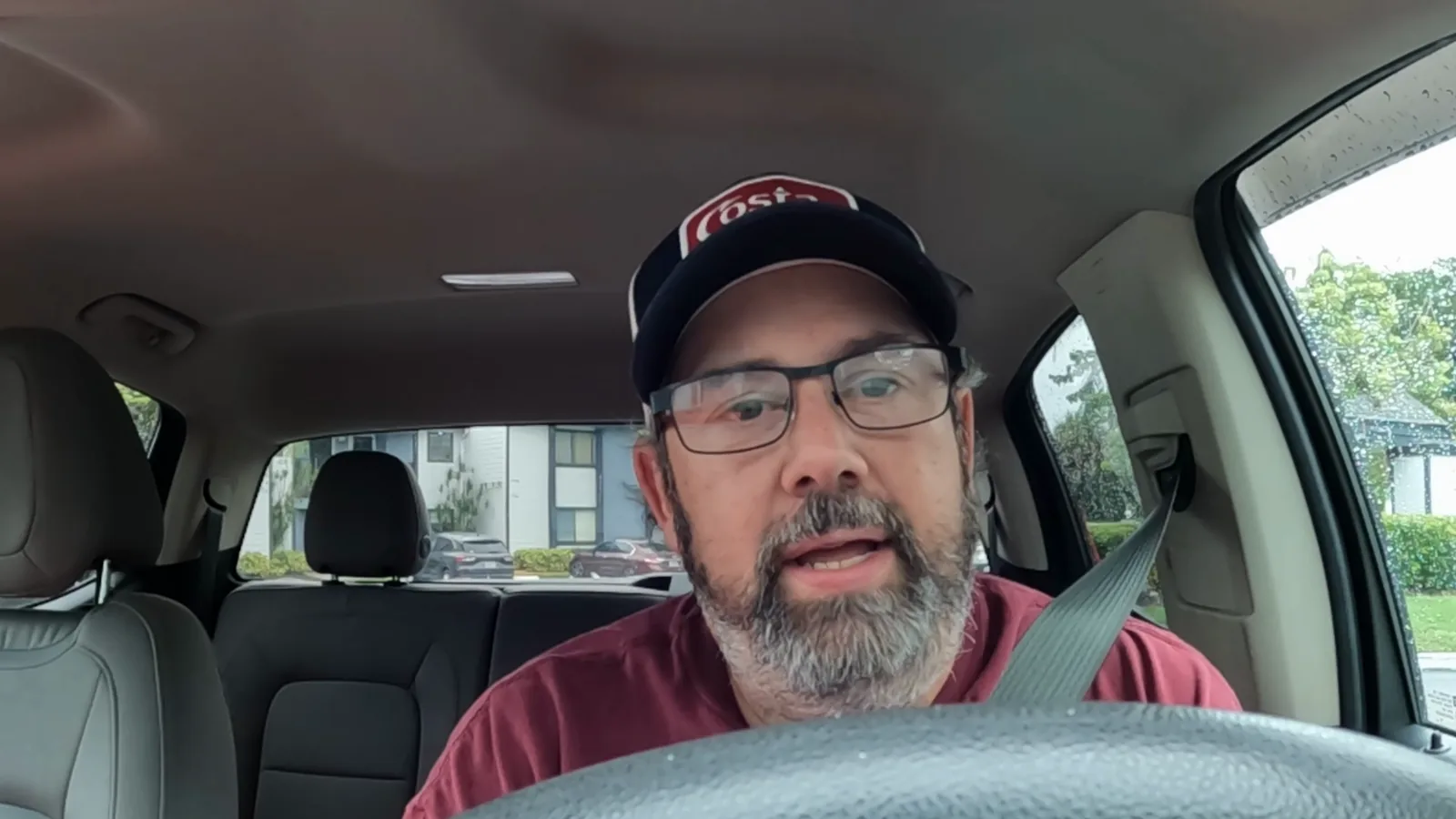 Derek documenting a rainy delivery shift from inside his truck