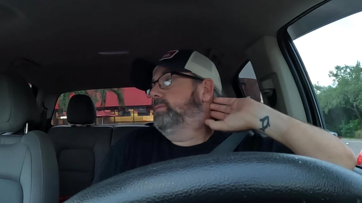 Derek waiting in his truck outside a restaurant during a delayed pickup