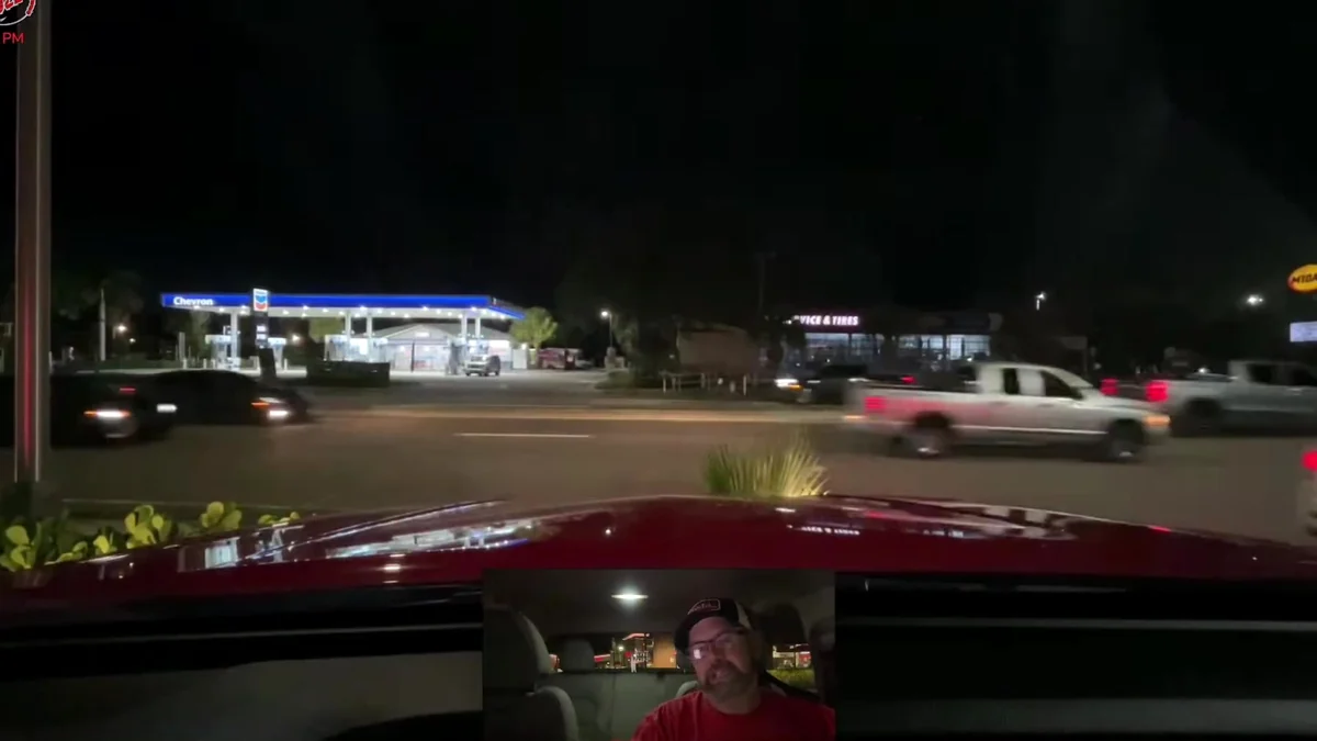 Night traffic seen through the windshield during the shift that ended with a low-oil warning