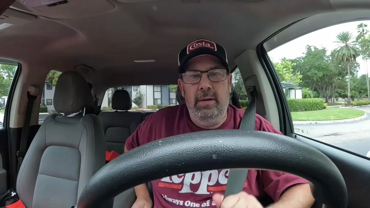 Derek in his truck at the beginning of a delivery shift during the week of Days 89 through 95