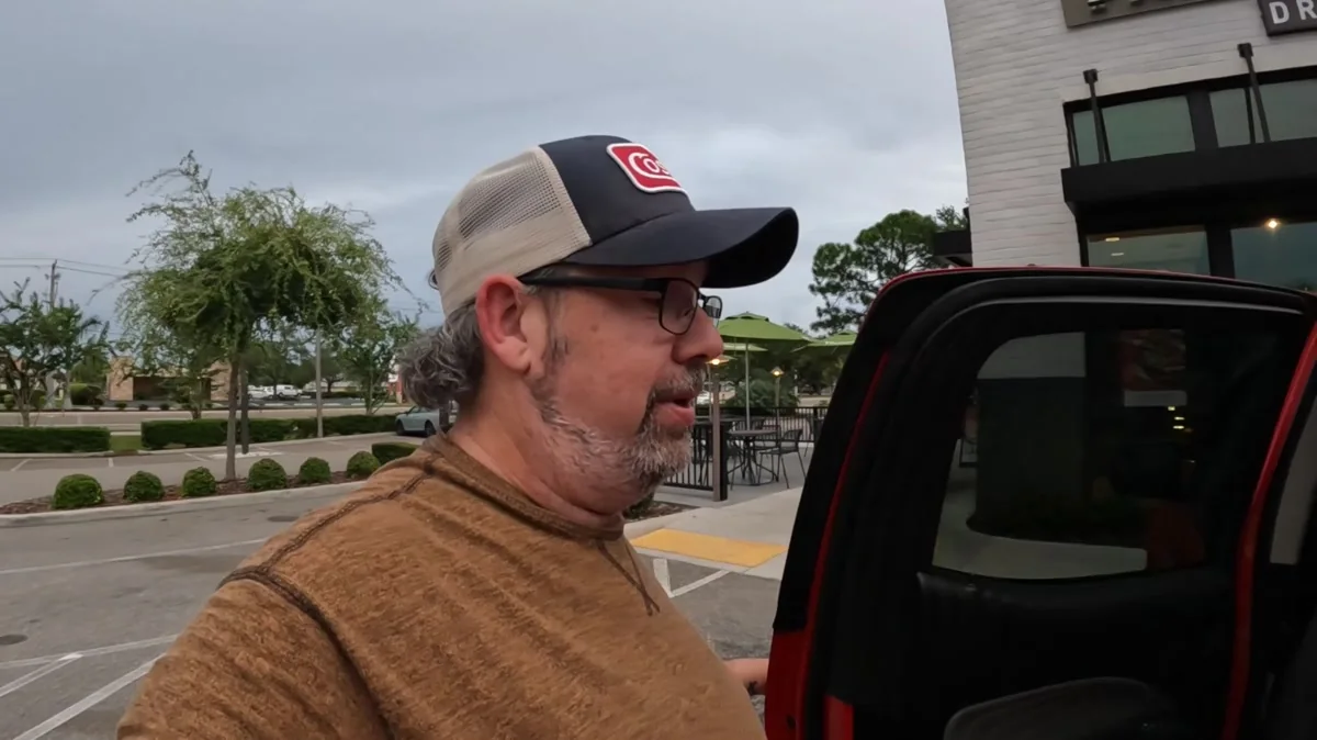 Derek beside his truck during Day 93 before choosing time with a friend over another hour of driving