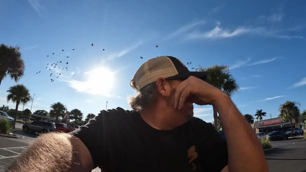 Derek pausing outside his truck during a delivery shift on Day 89